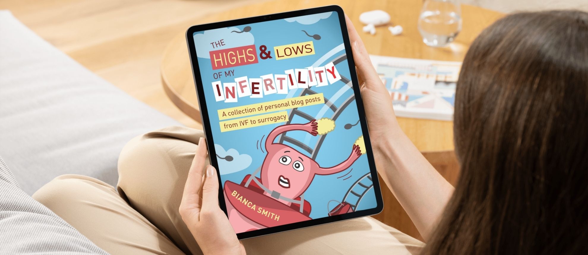 The Highs and Lows of my Infertility by Bianca Smith, custom Book Cover Design by Jo Petzer Cosmic Creations. Image shows the digital cover being viewed on a tablet screen.